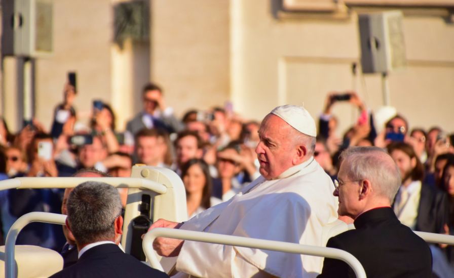 Pope Francis waves to the crowd at the end of his general audience during Canonization Ceremonies.

