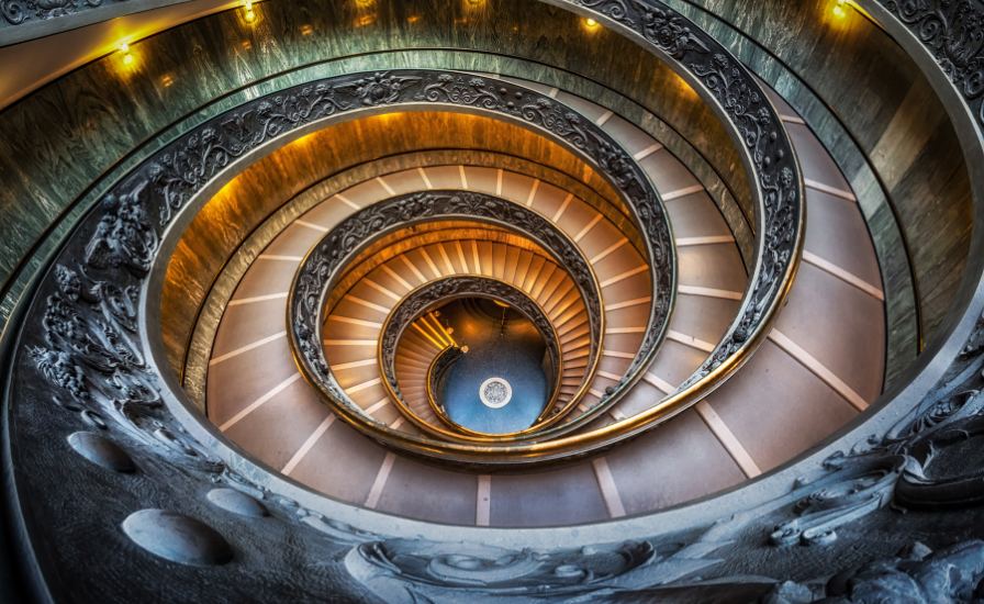 Iconic spiral staircase at Vatican Museums, showcasing beautiful craftsmanship and unique structure

