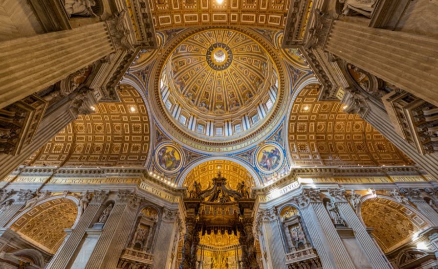 Interior of St. Peter's Basilica with a majestic dome ceiling
